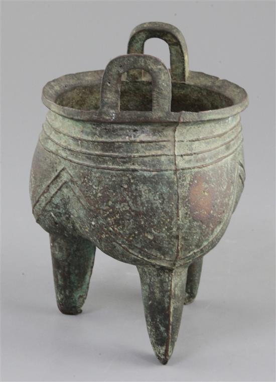 A Chinese archaic bronze tripod ritual vessel, Liding, 12th-11th century B.C., 17.5cm high